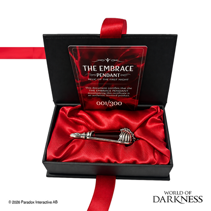 World of Darkness The Embrace Pendant, a limited edition gothic jewelry piece featuring a deep crimson red glass teardrop center set in an ornate silver-toned brass frame, displayed in a black presentation box with red satin lining alongside a numbered Certificate of Authenticity.