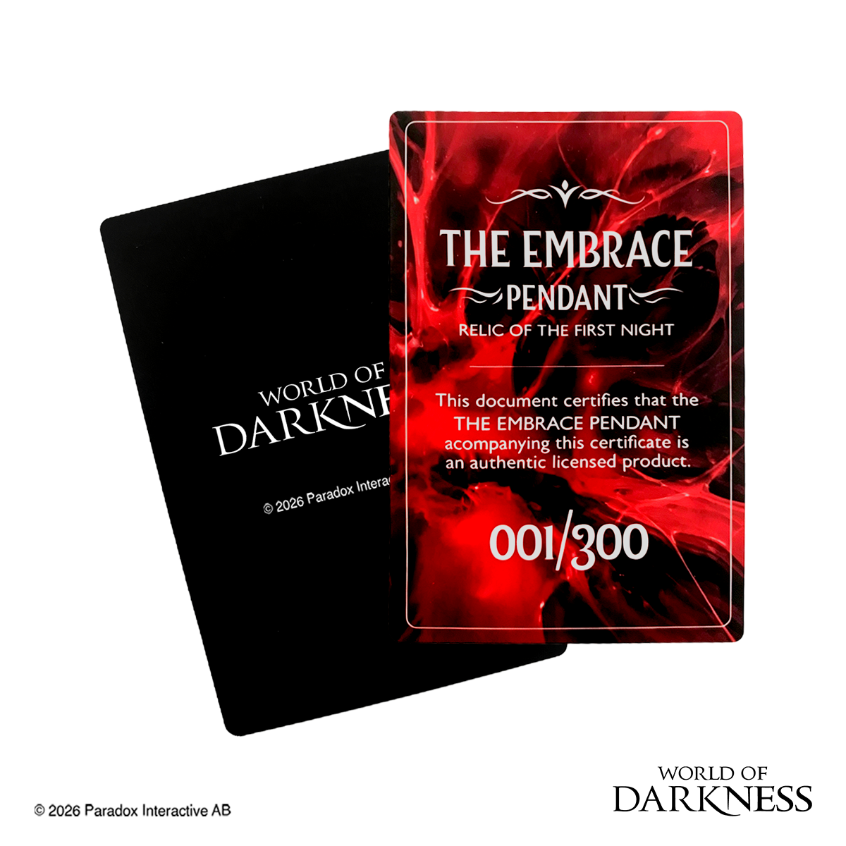 World of Darkness The Embrace Pendant, a limited edition gothic jewelry piece featuring a deep crimson red glass teardrop center set in an ornate silver-toned brass frame, displayed in a black presentation box with red satin lining alongside a numbered Certificate of Authenticity.