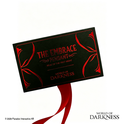 World of Darkness The Embrace Pendant, a limited edition gothic jewelry piece featuring a deep crimson red glass teardrop center set in an ornate silver-toned brass frame, displayed in a black presentation box with red satin lining alongside a numbered Certificate of Authenticity.